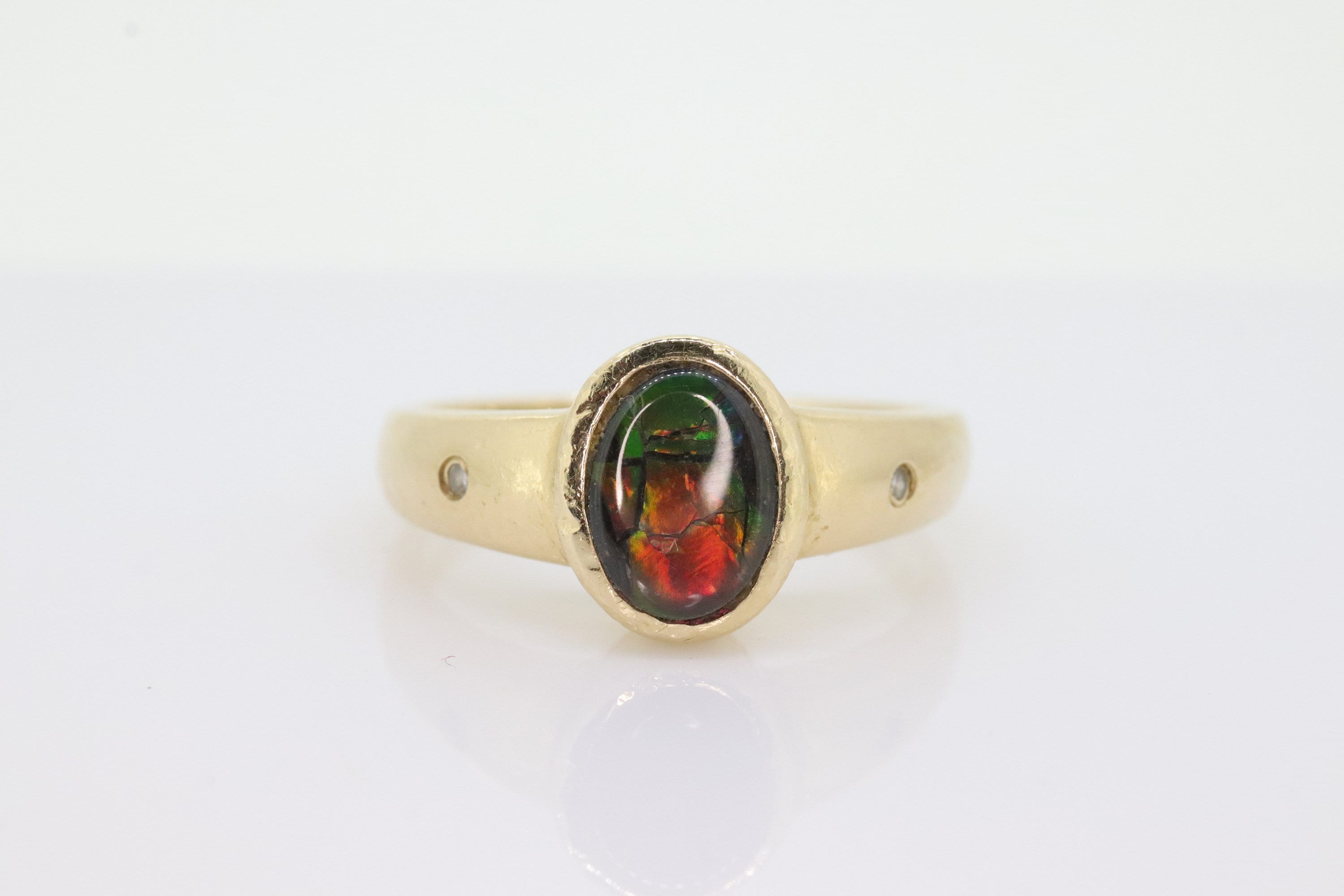 14k Oval Bezel Set Ammolite Ring. Ammolite Fossil and diamond ring. Ammolite Bezel set. st70