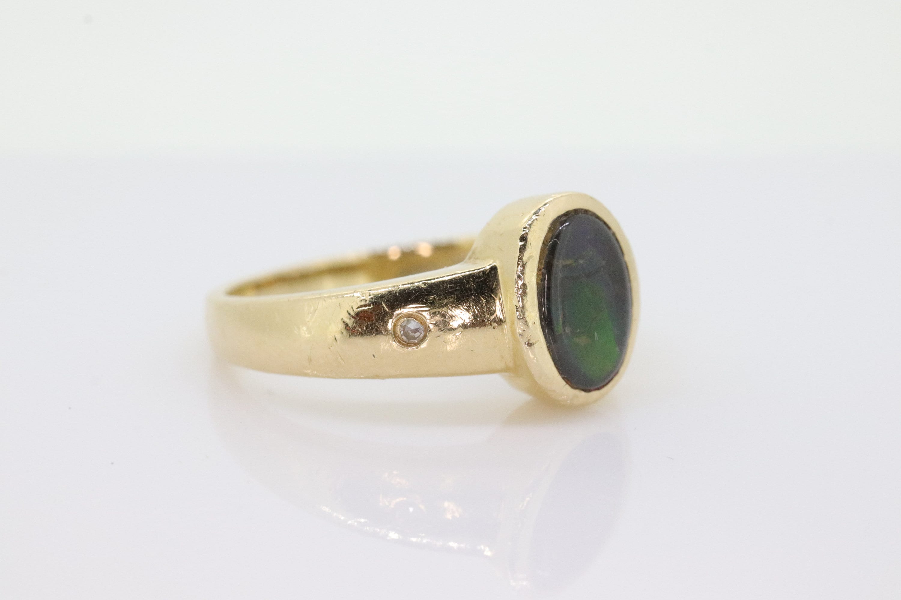 14k Oval Bezel Set Ammolite Ring. Ammolite Fossil and diamond ring. Ammolite Bezel set. st70