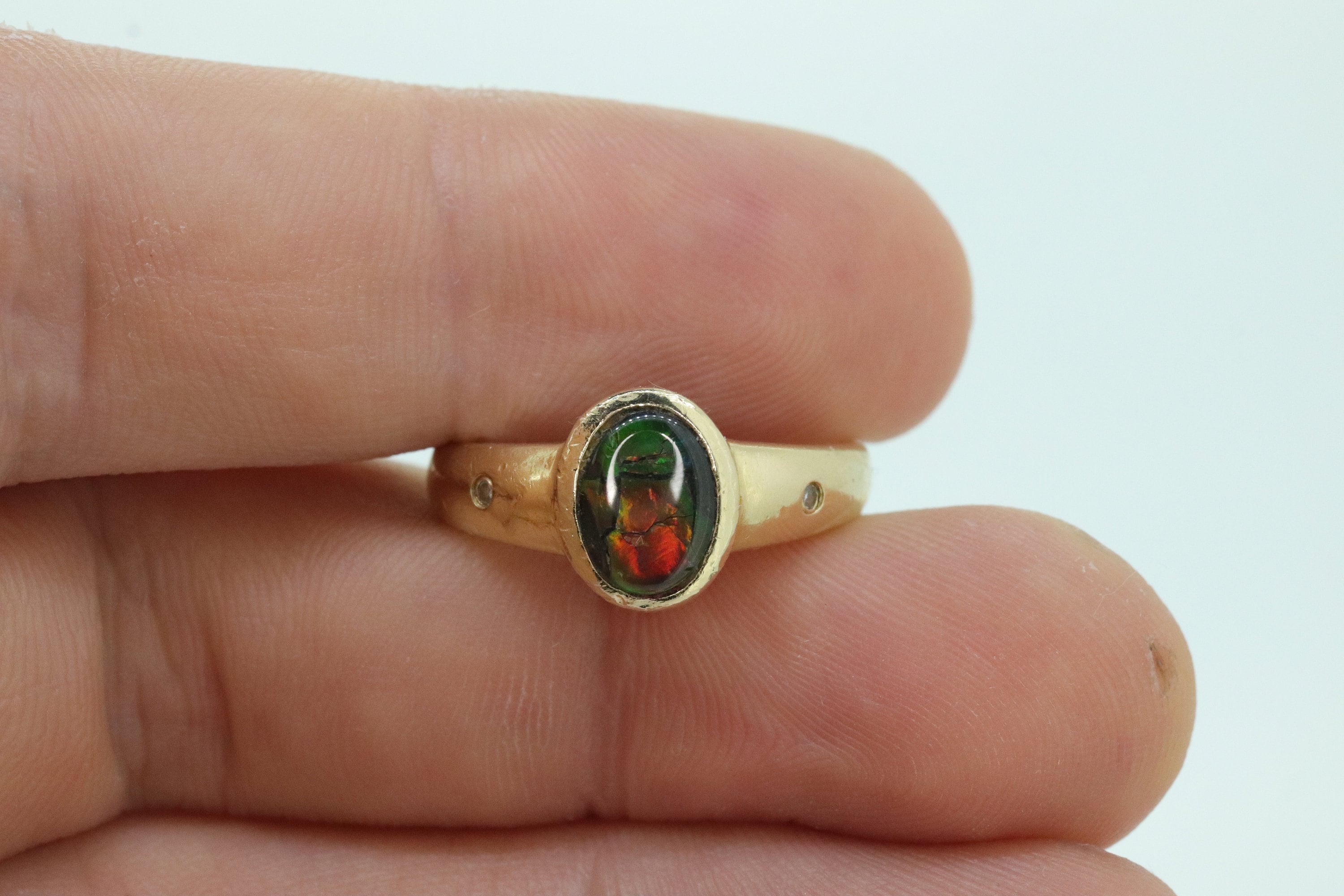 14k Oval Bezel Set Ammolite Ring. Ammolite Fossil and diamond ring. Ammolite Bezel set. st70