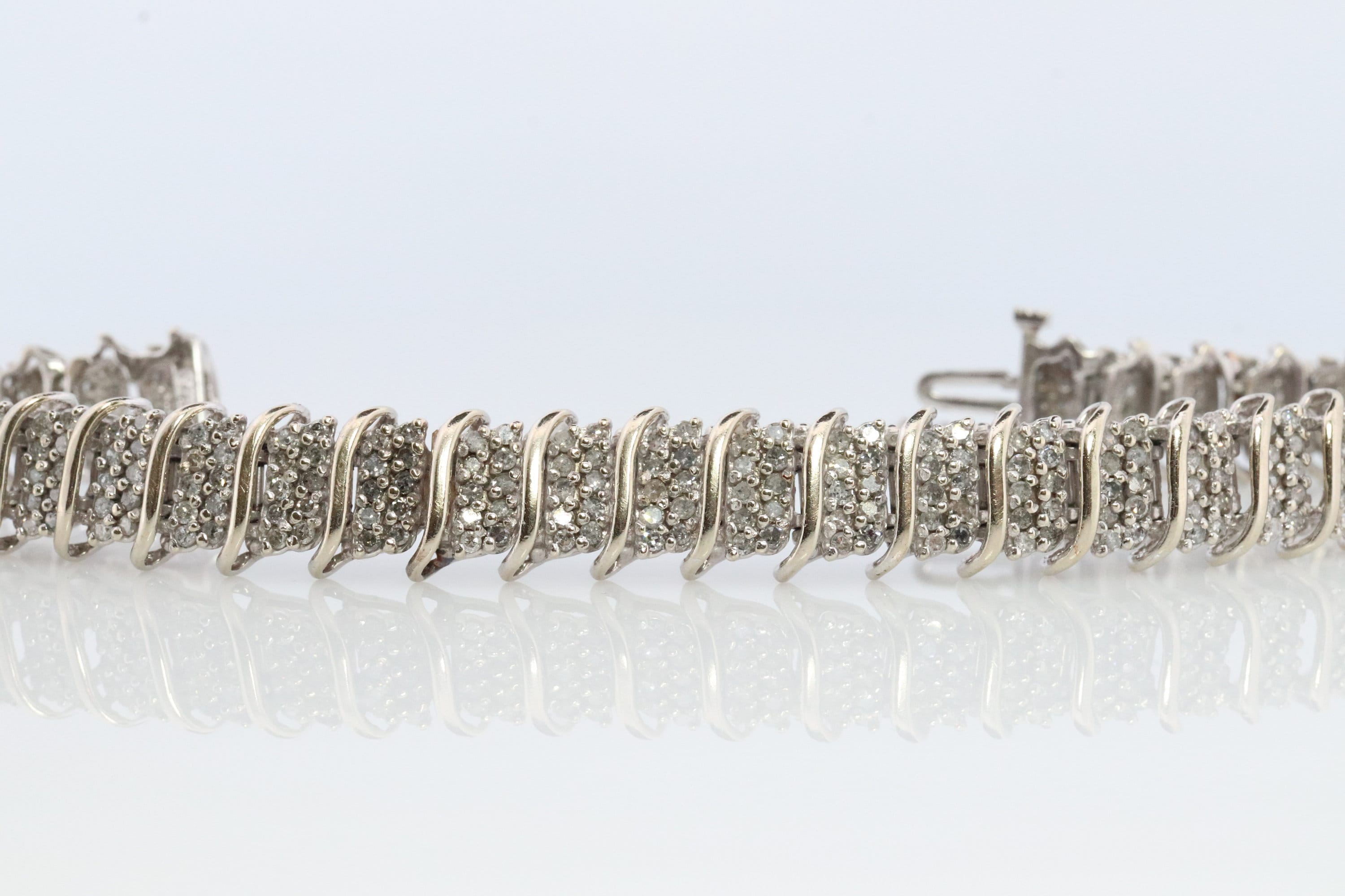 10k Diamond Tennis Bracelet. 10k S-LINK round diamond cluster Tennis bracelet. 2CTW JAFA wide tennis bracelet.