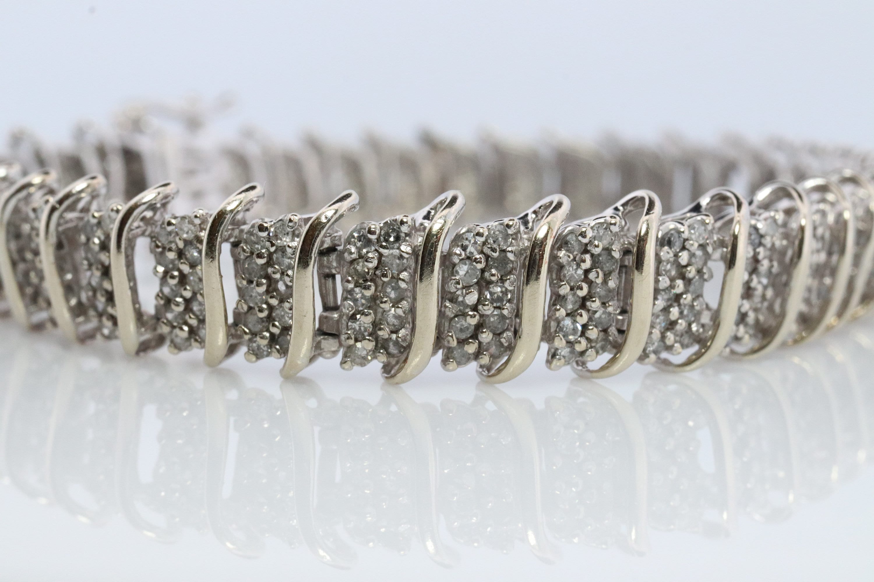 10k Diamond Tennis Bracelet. 10k S-LINK round diamond cluster Tennis bracelet. 2CTW JAFA wide tennis bracelet.