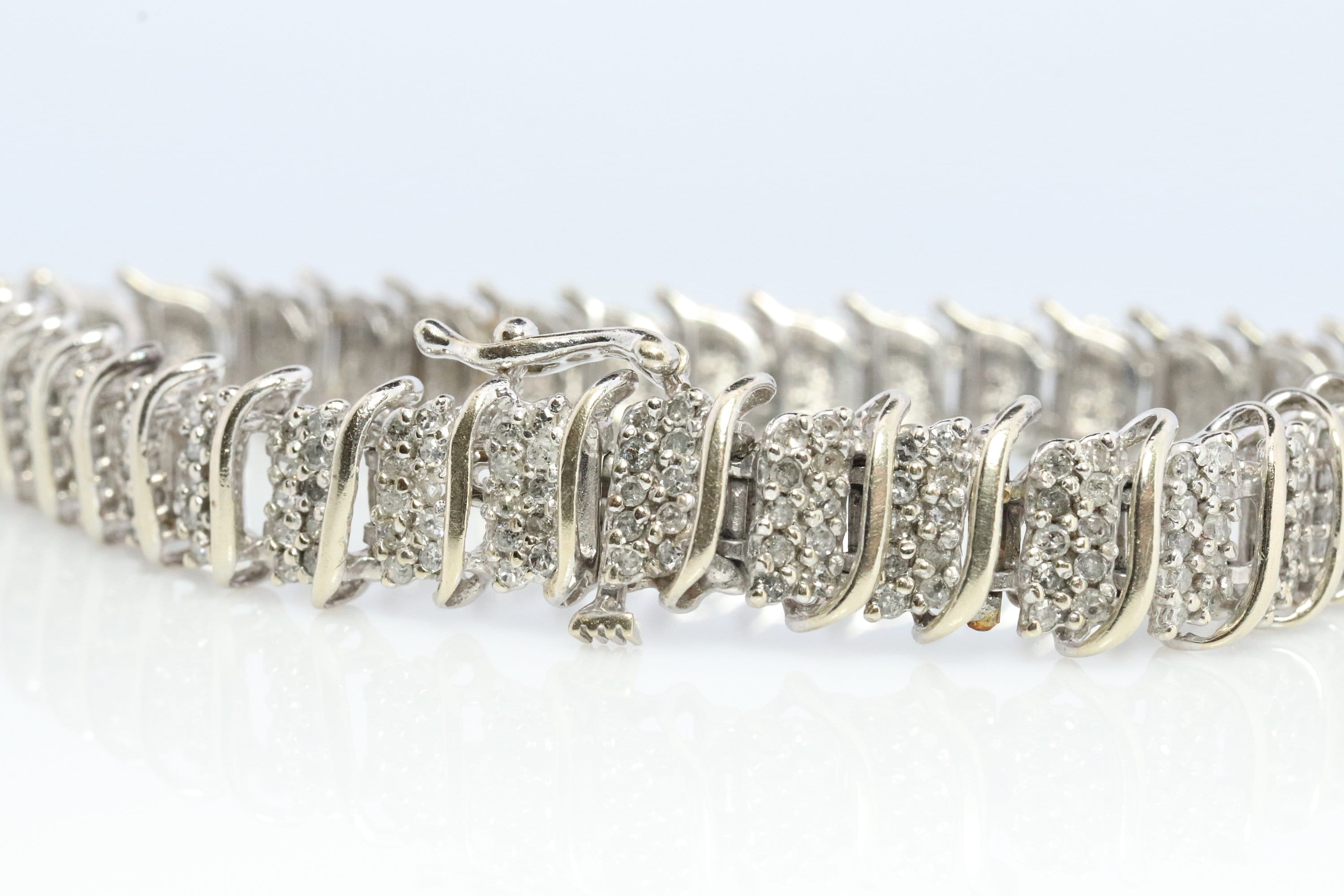 10k Diamond Tennis Bracelet. 10k S-LINK round diamond cluster Tennis bracelet. 2CTW JAFA wide tennis bracelet.