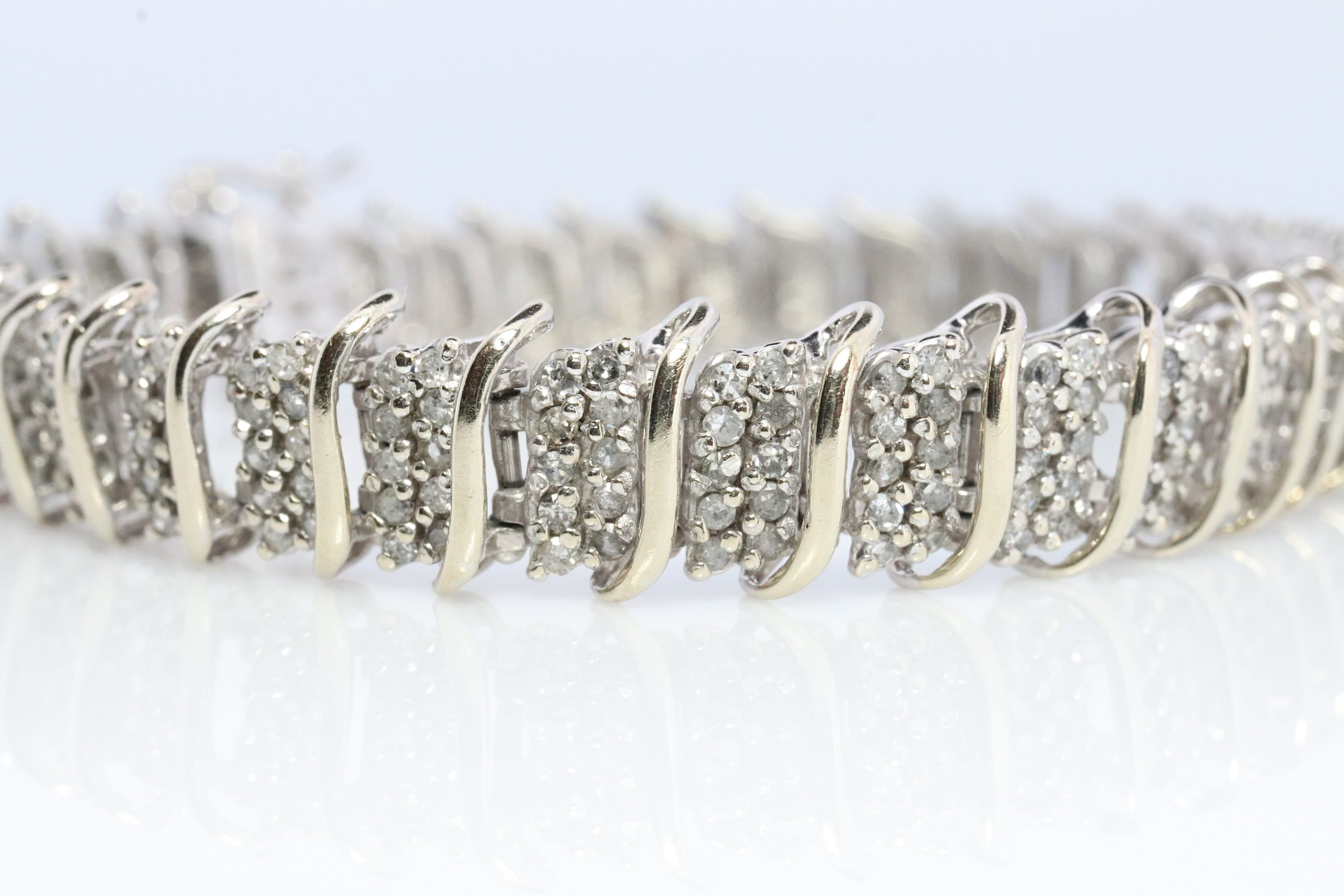 10k Diamond Tennis Bracelet. 10k S-LINK round diamond cluster Tennis bracelet. 2CTW JAFA wide tennis bracelet.