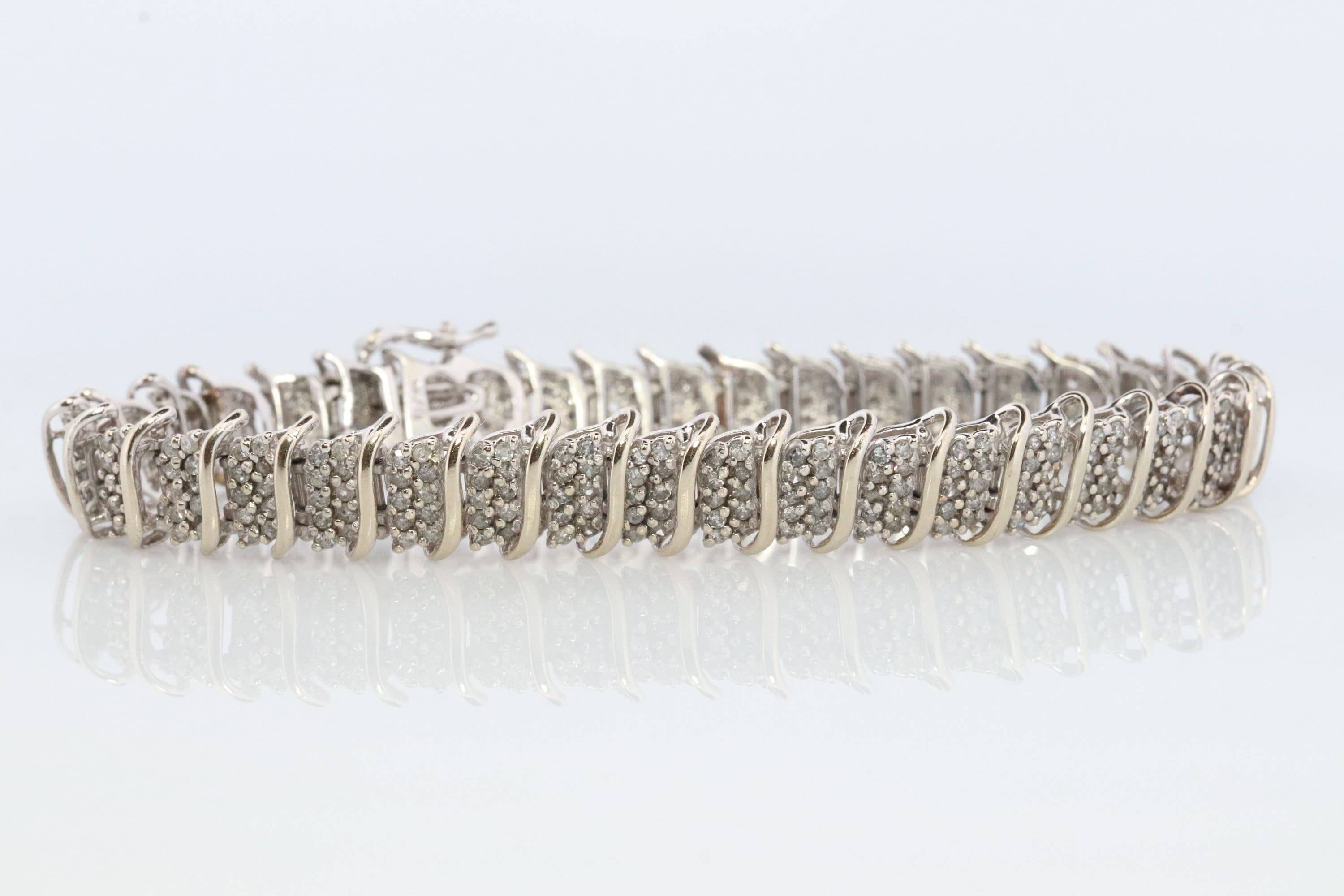 10k Diamond Tennis Bracelet. 10k S-LINK round diamond cluster Tennis bracelet. 2CTW JAFA wide tennis bracelet.