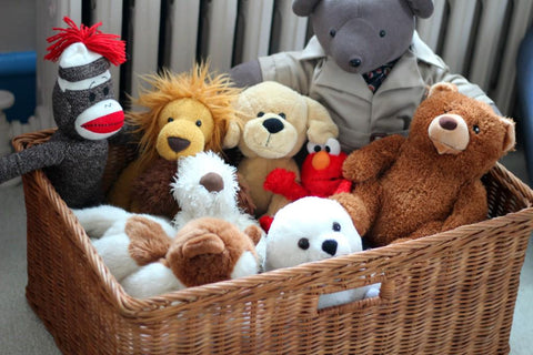 stuffed animals in basket