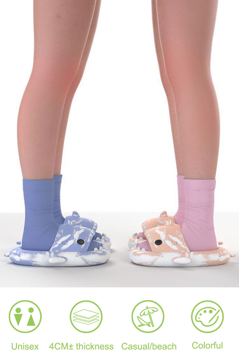 two people wearing tie dye shark crocs