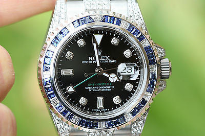 ROLEX GMT MASTER II STAINLESS STEEL 5 CTS. DIAMONDS AND SAPPHIRES BEZEL UNWORN