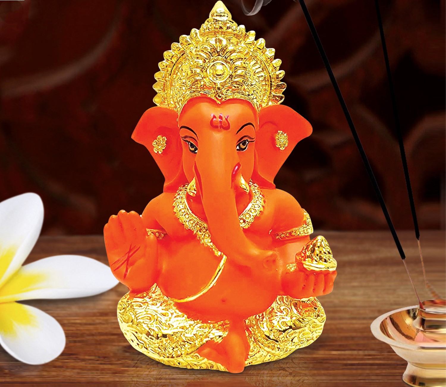 Captivating Gold-Plated Orange Ceramic Ganesha Idol