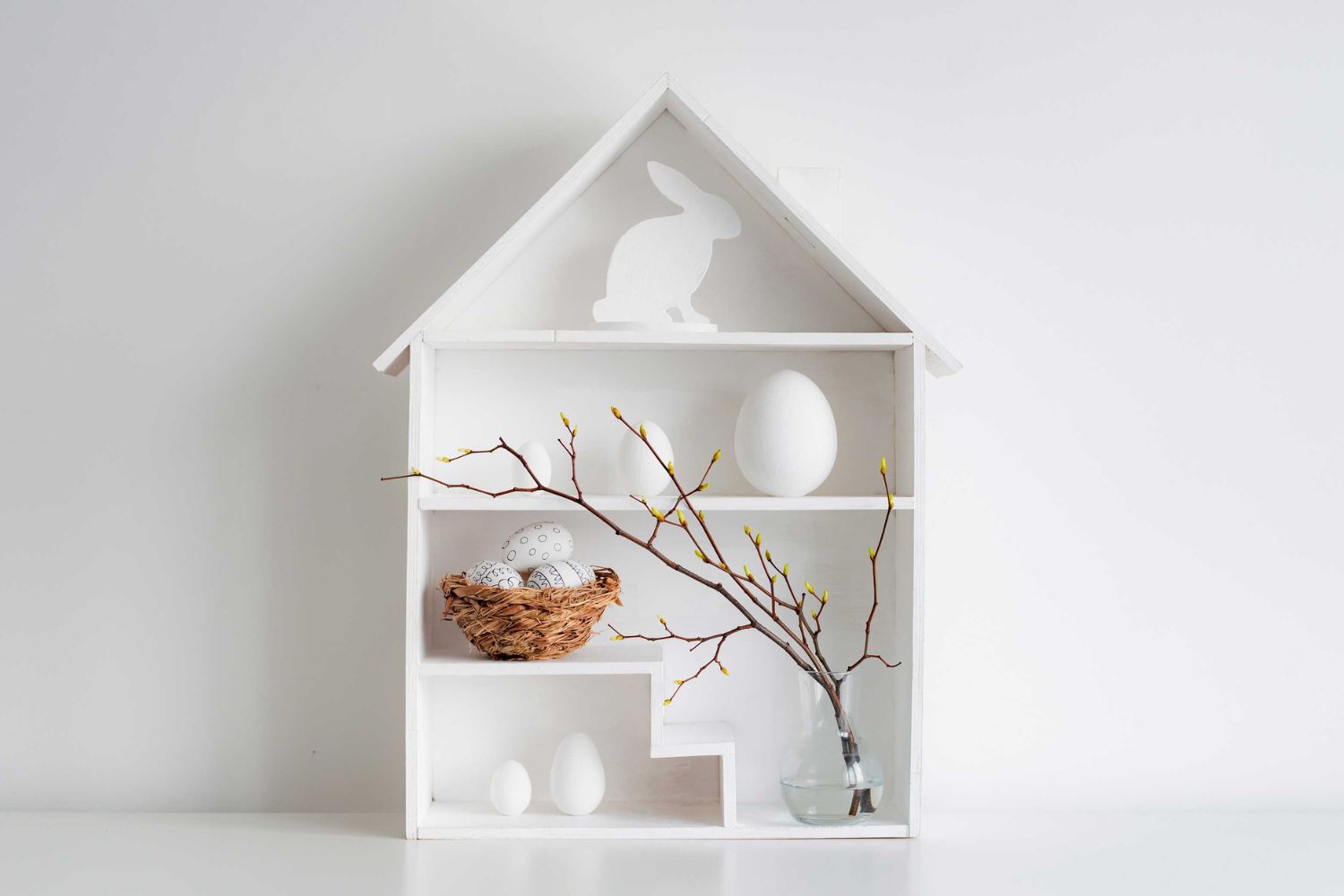 mini white shelf with white egg and rabbit, plants
