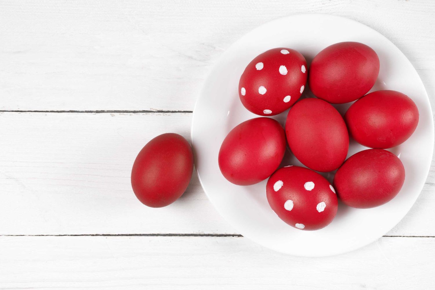 red eggs in white plate