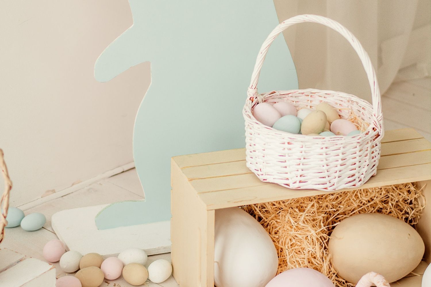 Easter basket with scattered eggs