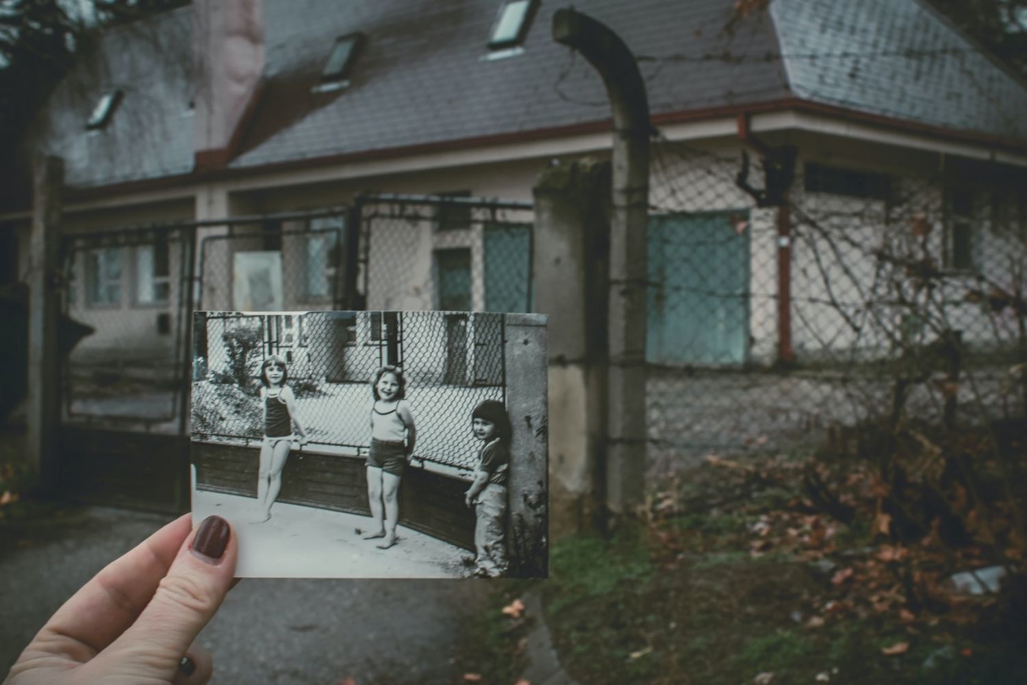 a childhood photo held in the same place when taking photo