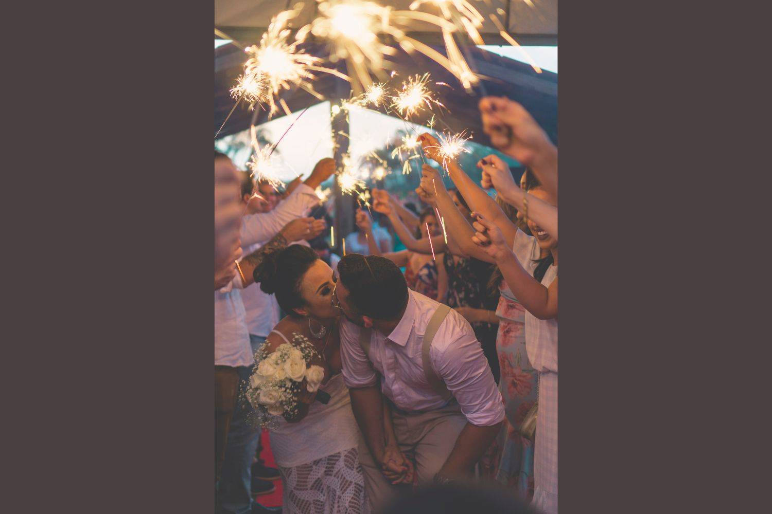the couple is kissing in the crowed