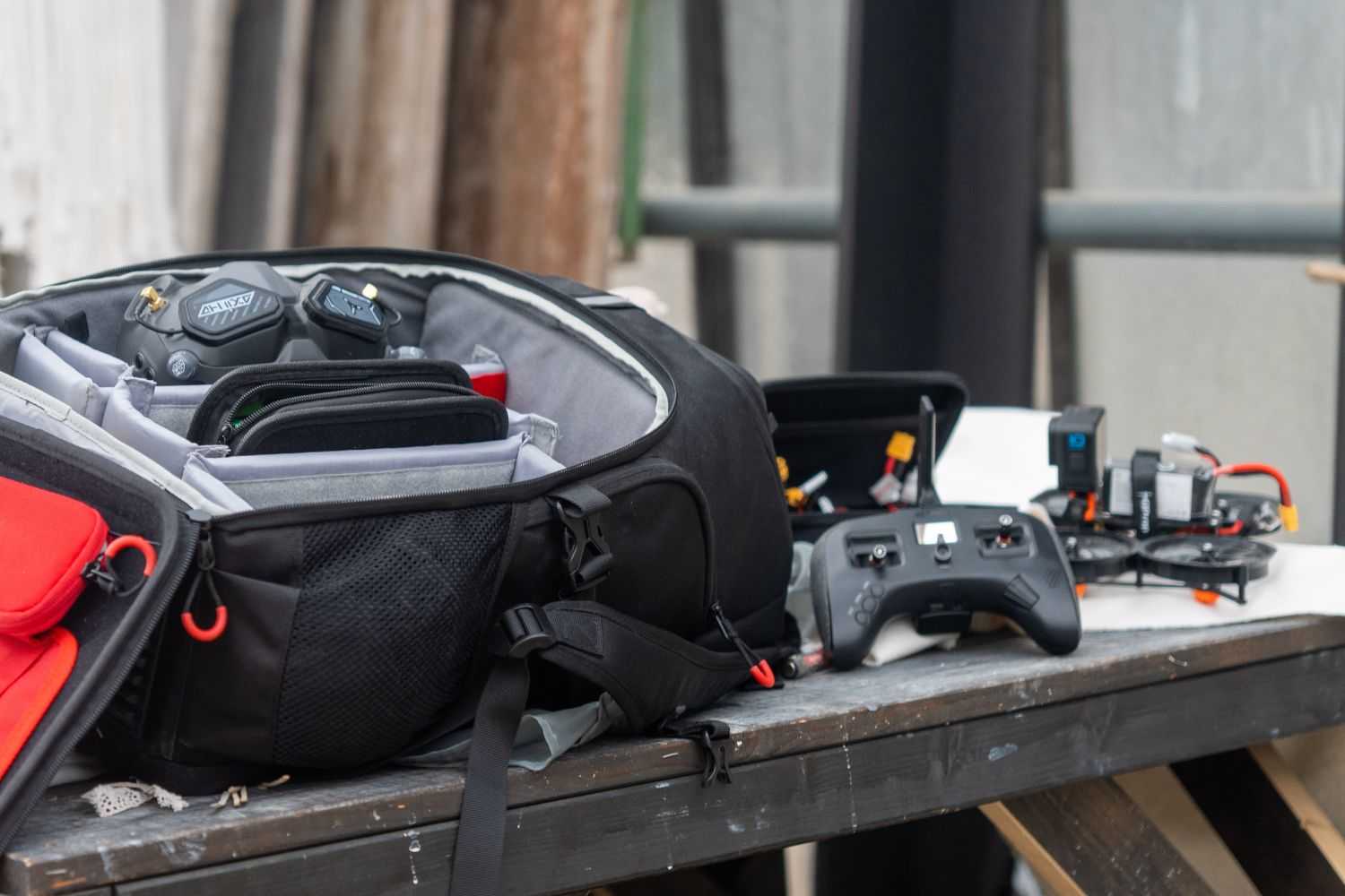 Drone components and backpacks on the table
