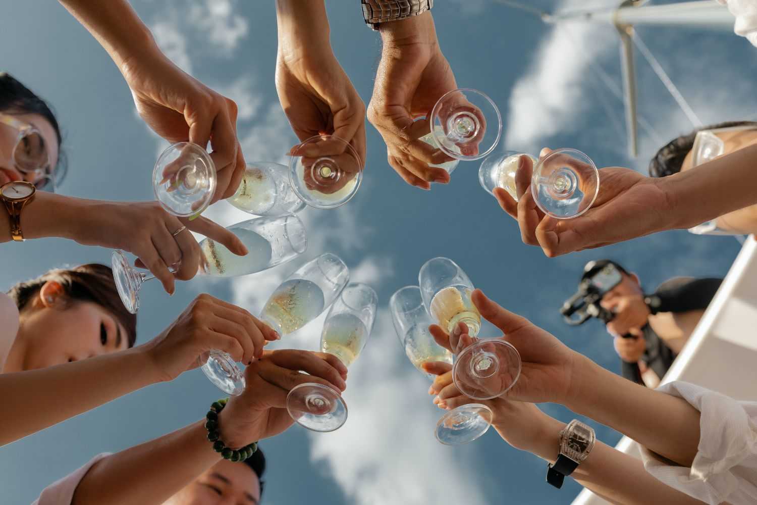 people holding champagne