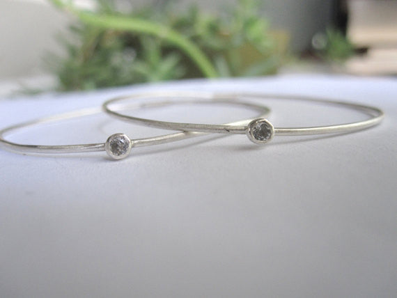 Elegant And Attractively Designed Sterling Silver Round Wire Hoops With A White Topaz Insert - 0189
