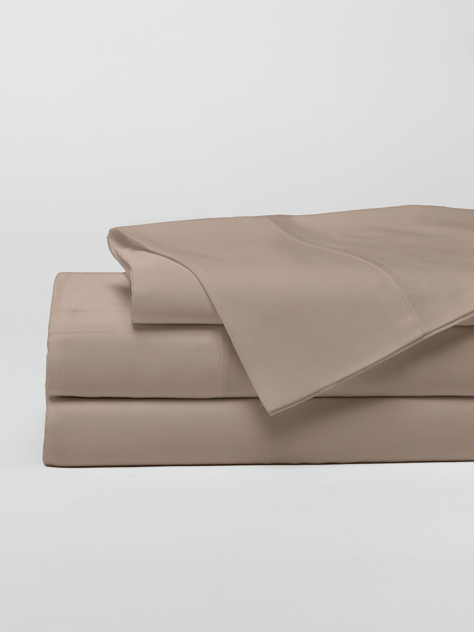 Walnut sheet set folded with a white background 