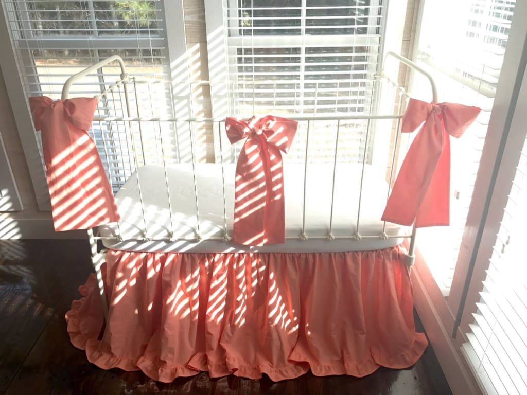 Coral Ruffled Crib Skirt and Large Crib Bows