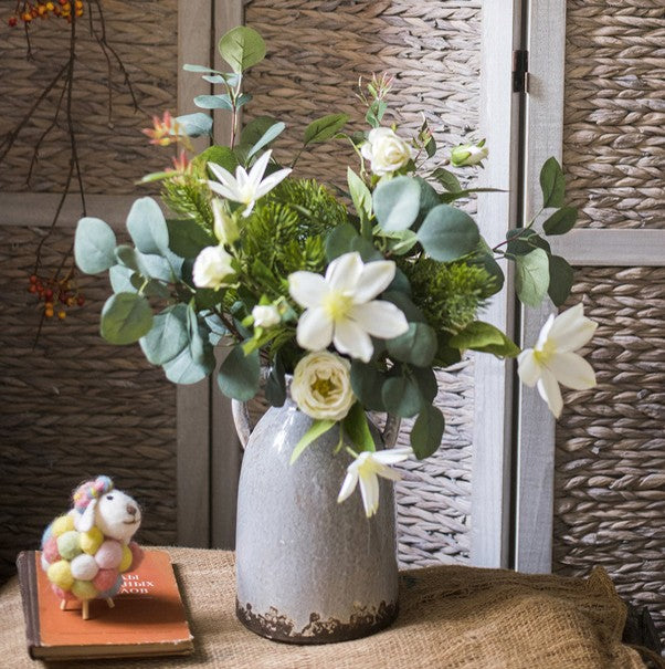 Eucalyptus globulus. Clematis. White Rose Flowers. Unique Flower Arrangement for Home Decoration. Beautiful Modern Artificial Flowers for Living Room