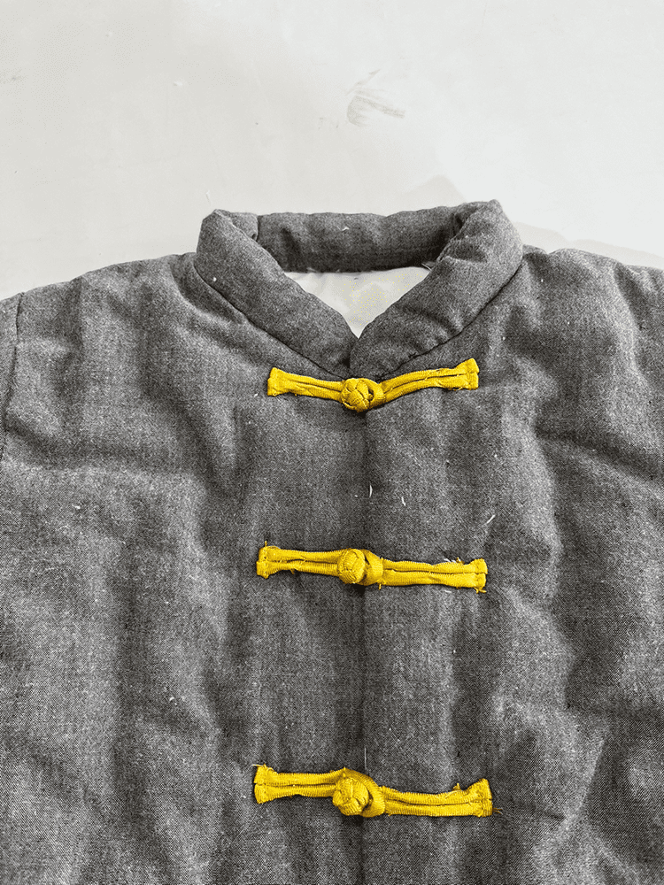 Dark grey padded tang suit for children